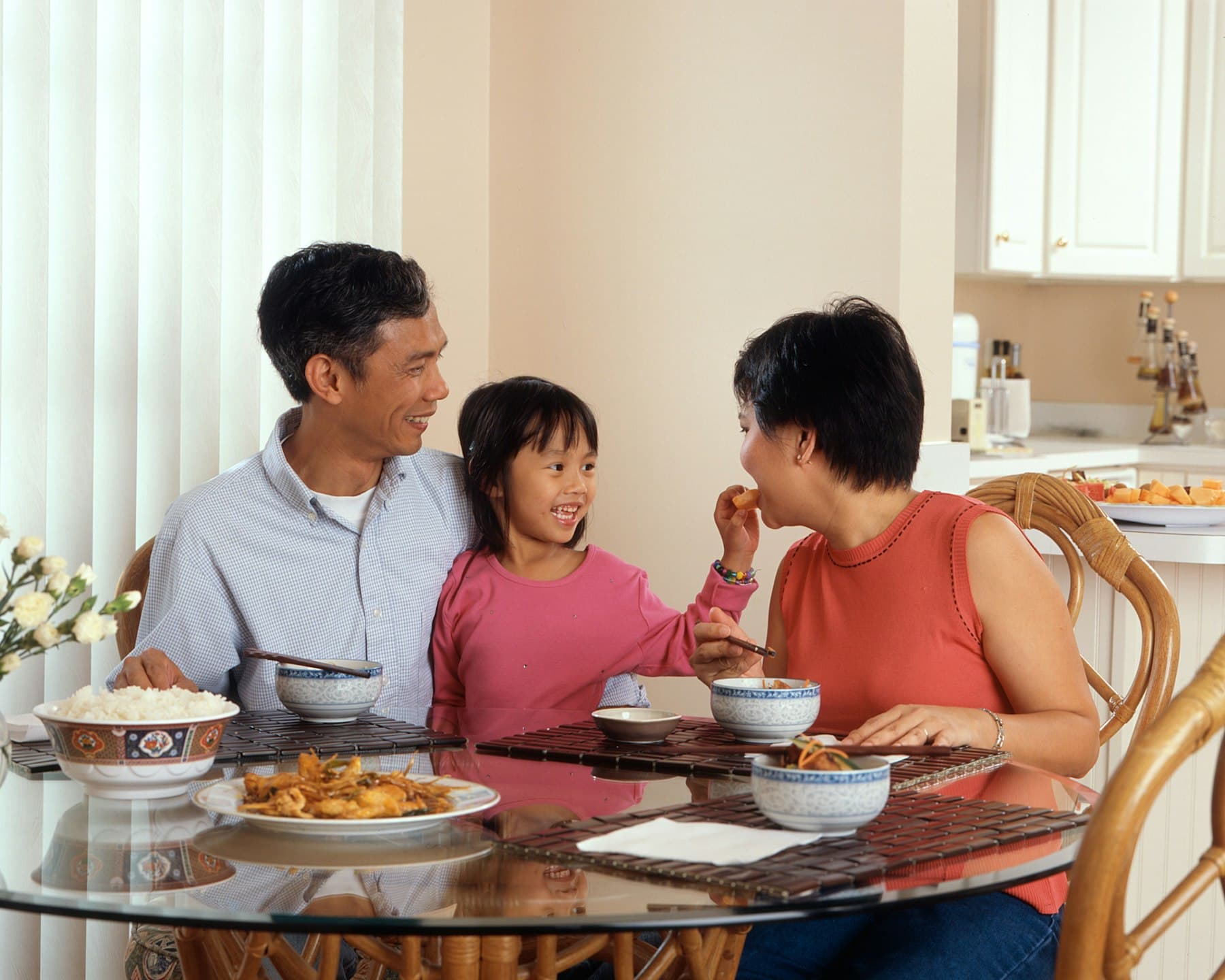 A family sharing a meal at a dining table